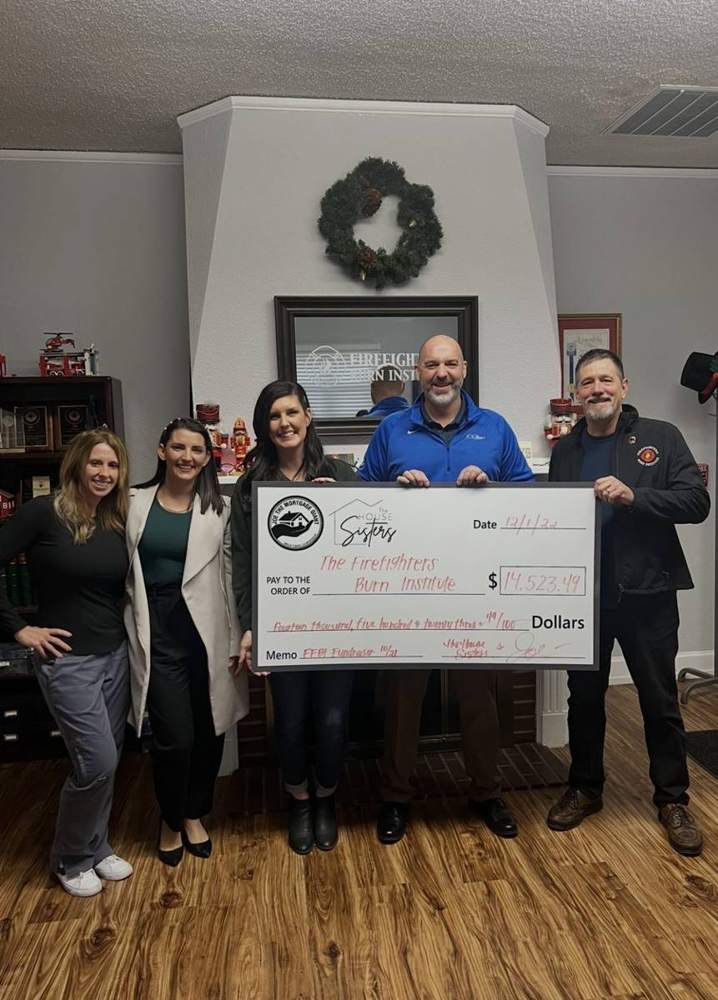 Presenting a donation to the Firefighters Burn Institute