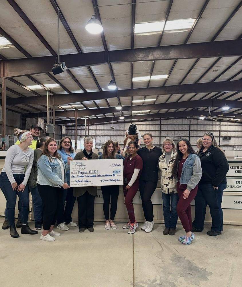 Presenting a donation check at Project R.I.D.E.
